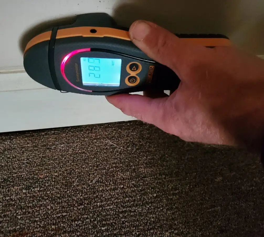 Moisture detection at baseboard during Storm Damage Restoration in Westlake